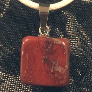 Red Gemstone Necklace on White Cord